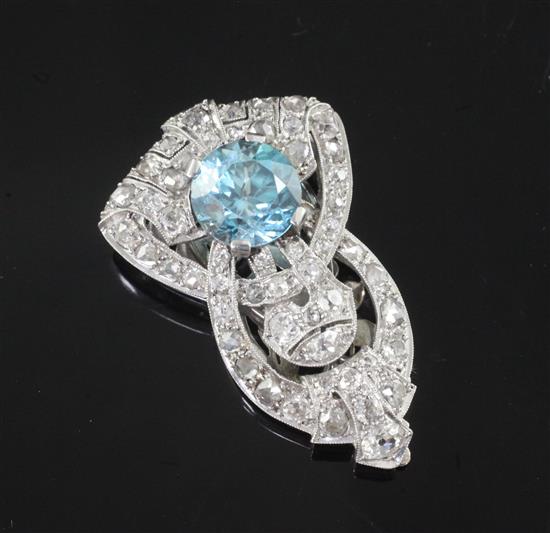An Art Deco platinum?, blue zircon, rose and round cut diamond set lapel clip, 35mm.